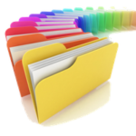 Obrazek pokazujący foldery w postaci ułożonych w kształt akordeonu papierowych kolorowych skoroszytów